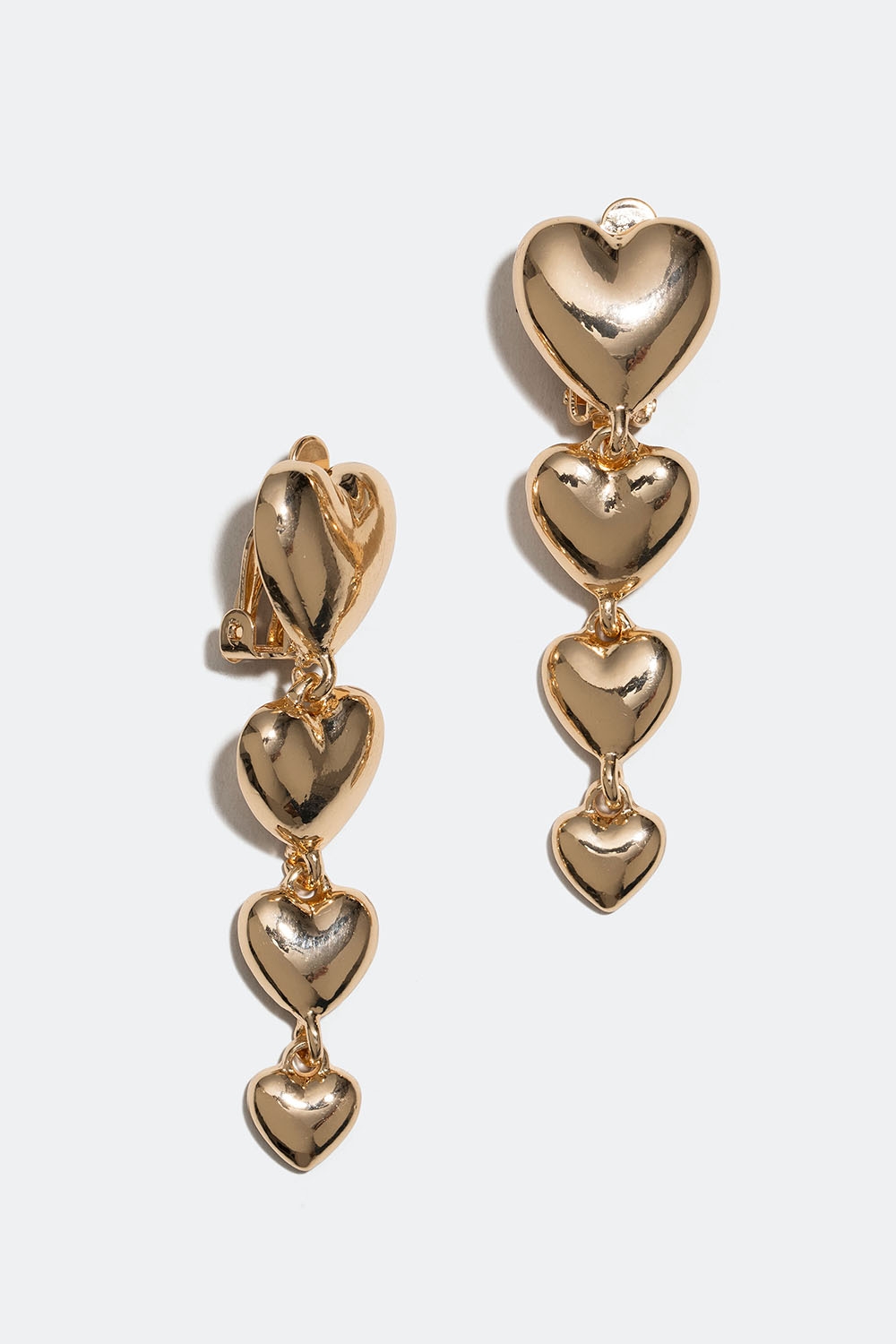 Clipsörhängen med hängande guldfärgade hjärtan i gruppen Smycken / Örhängen hos Glitter (253005442002)