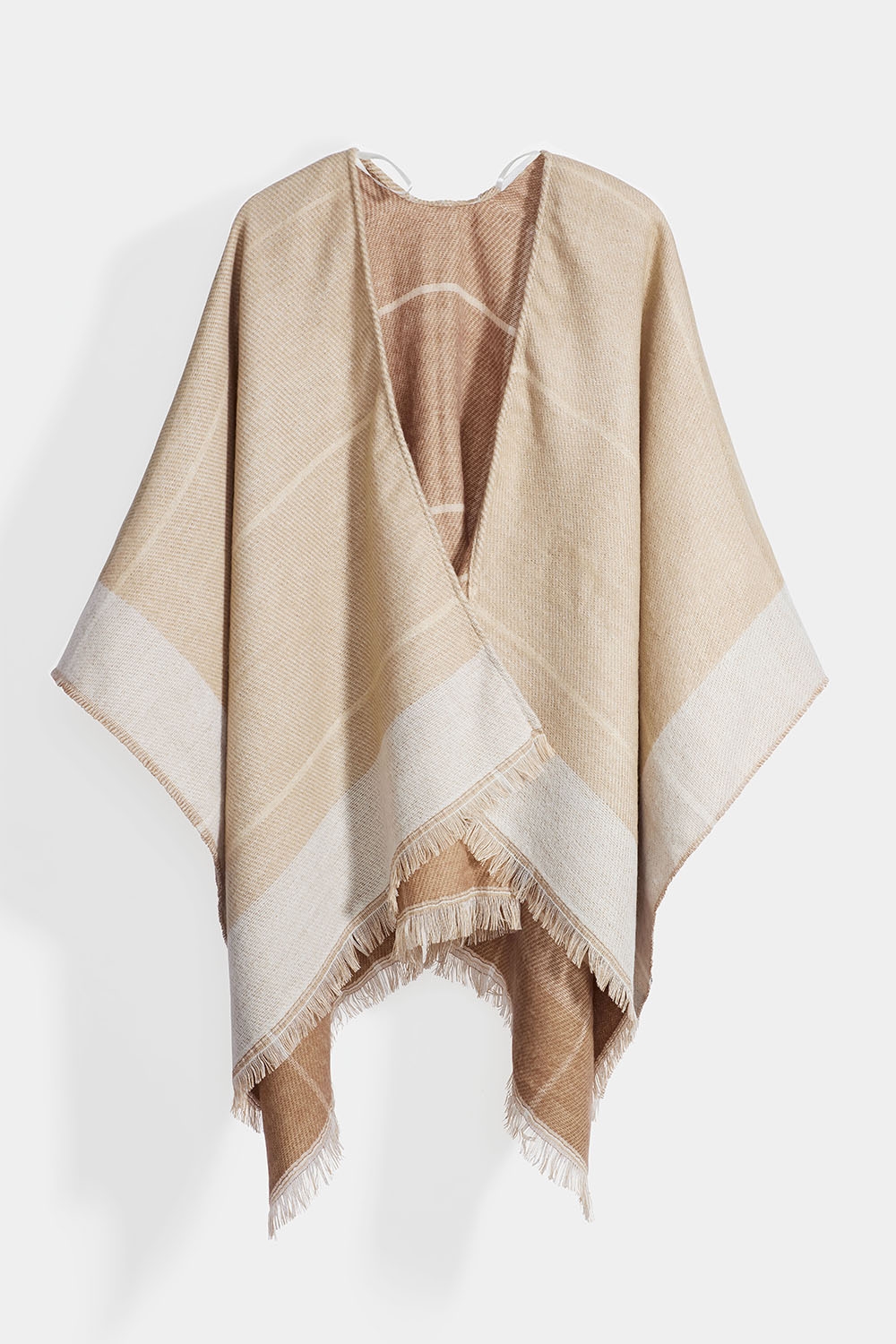 Beige poncho med fransar i gruppen Accessoarer / Stickat / Ponchos hos Glitter (171001768600)