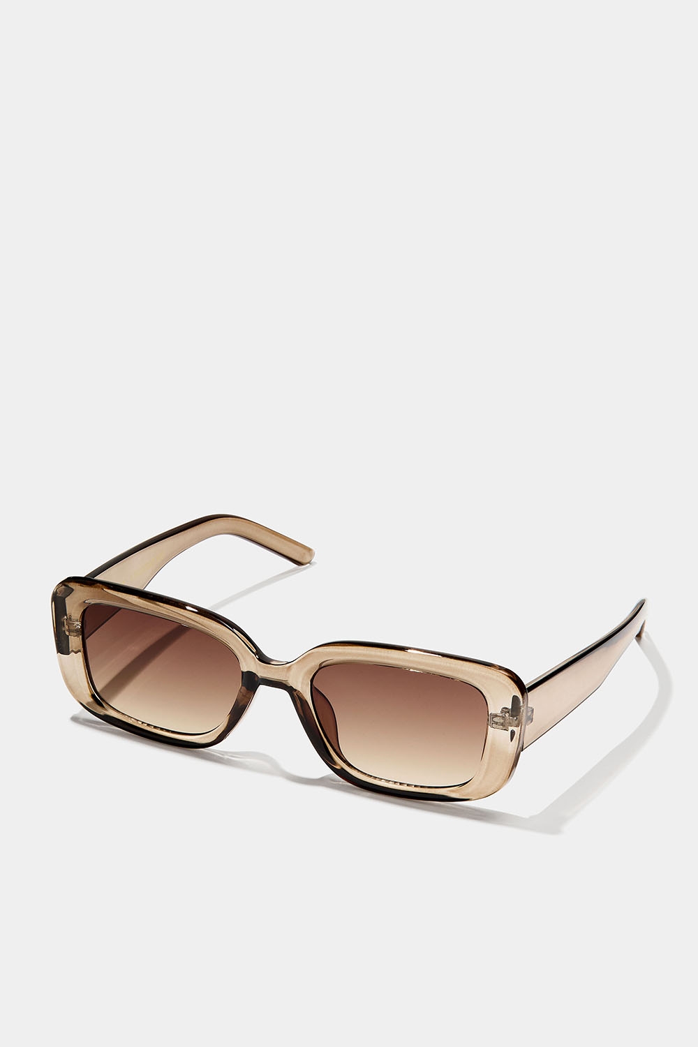 Kantiga solglasögon med transparanta ljusbruna bågar i gruppen Accessoarer / Solglasögon hos Glitter (176000908100)