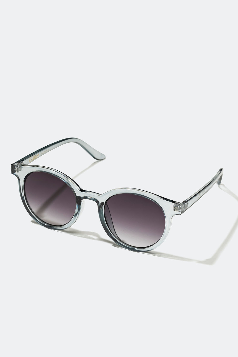 Runda solglasögon med transparenta ljusgråa bågar i gruppen Accessoarer / Solglasögon hos Glitter (176000987100)