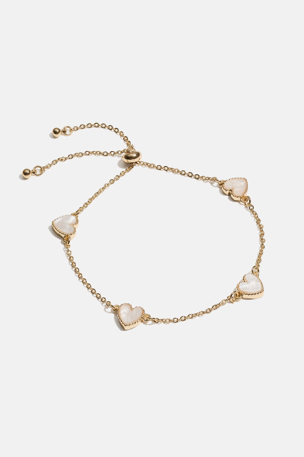 Guldfärgat armband med vita hjärtan i gruppen Smycken / Armband hos Glitter (251001653002)