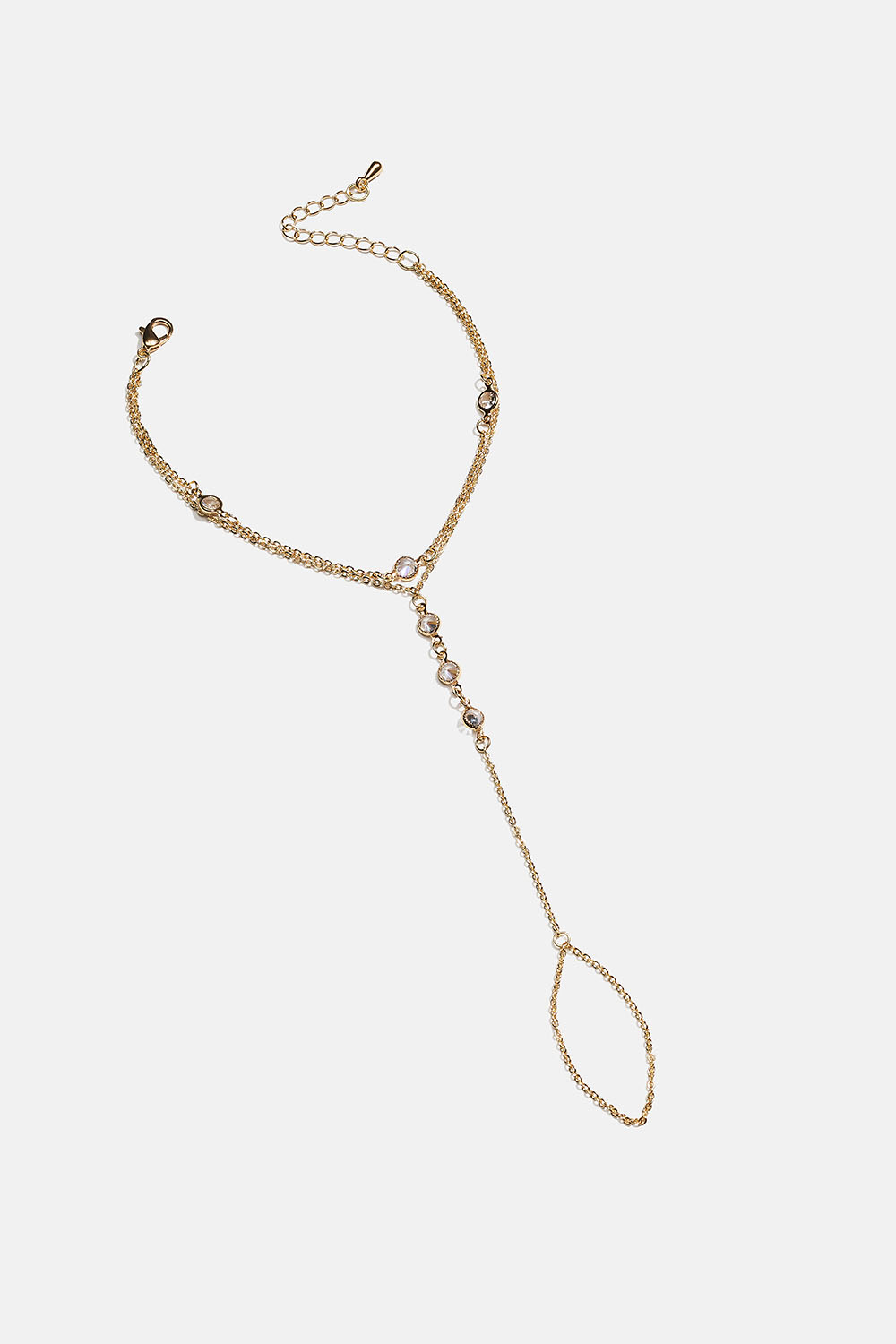 Guldfärgad handkedja med ring och glasstenar i gruppen Smycken / Armband hos Glitter (251002082002)