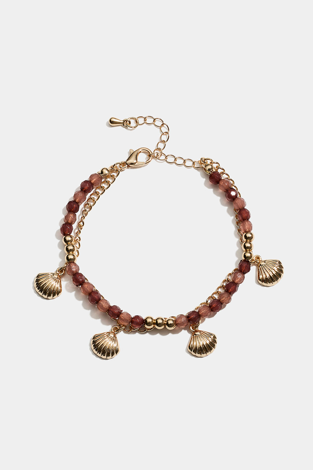 Dubbelarmband med bruna pärlor och snäckor i gruppen Smycken / Armband hos Glitter (251002118002)