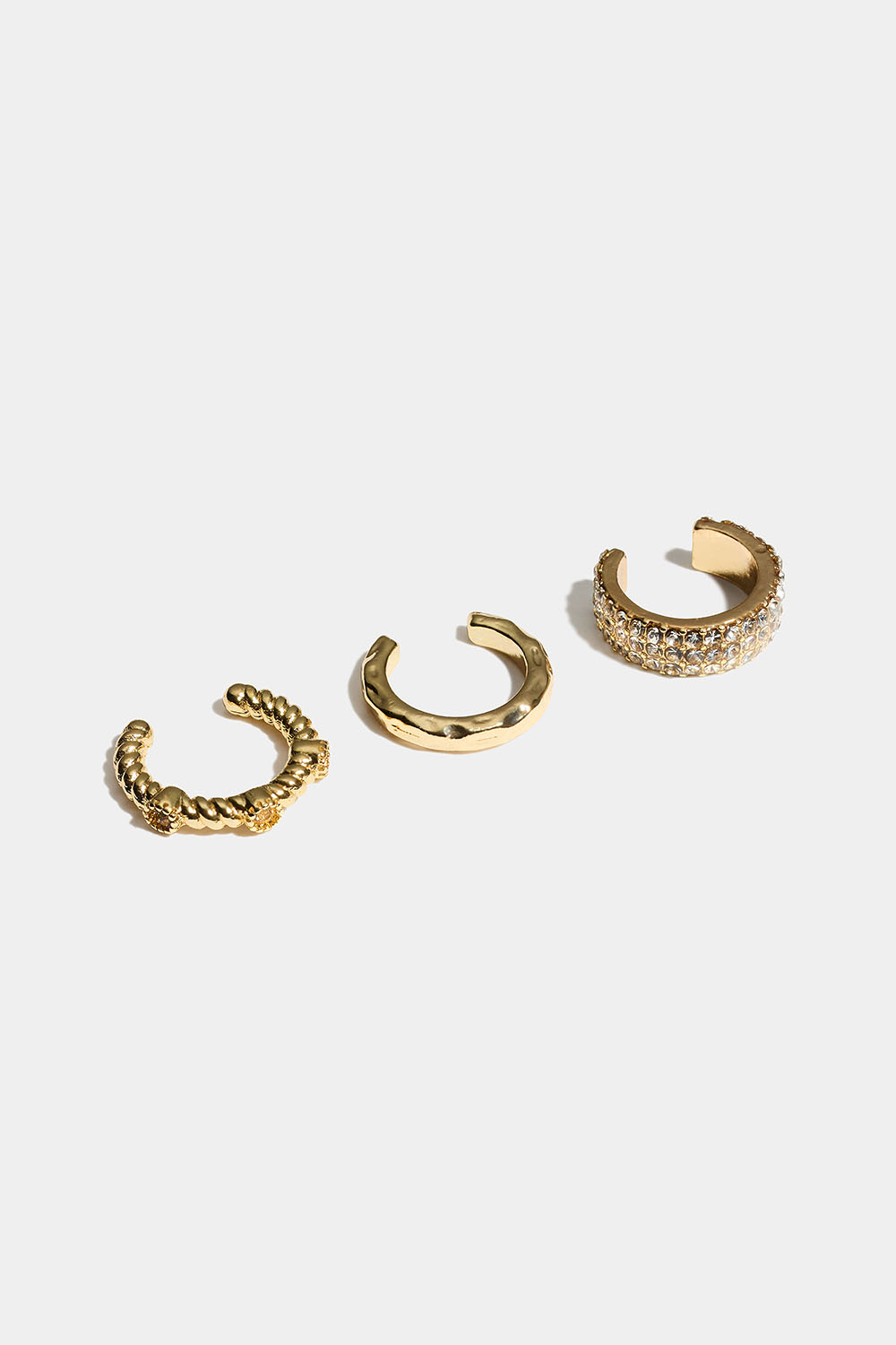 Guldfärgade ear cuffs med struktur och glasstenar, 3-pack i gruppen Smycken / Örhängen / Earcuffs hos Glitter (253011792002)