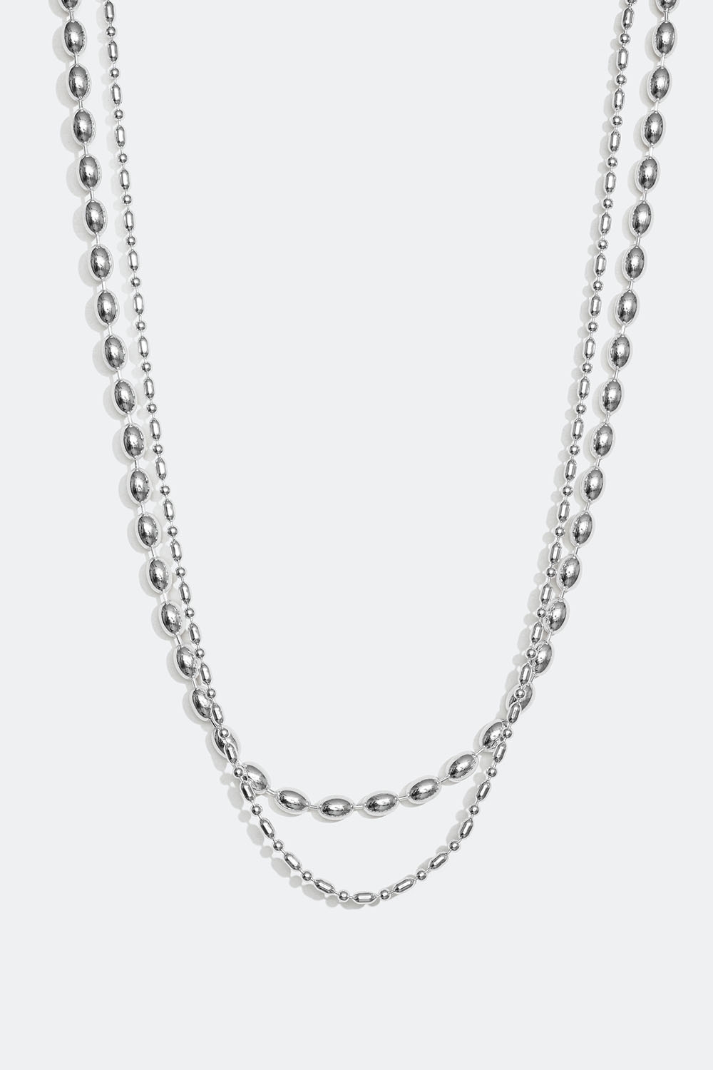 Dubbelhalsband med ovala pärlor i metall i gruppen Smycken / Halsband hos Glitter (254001311001)