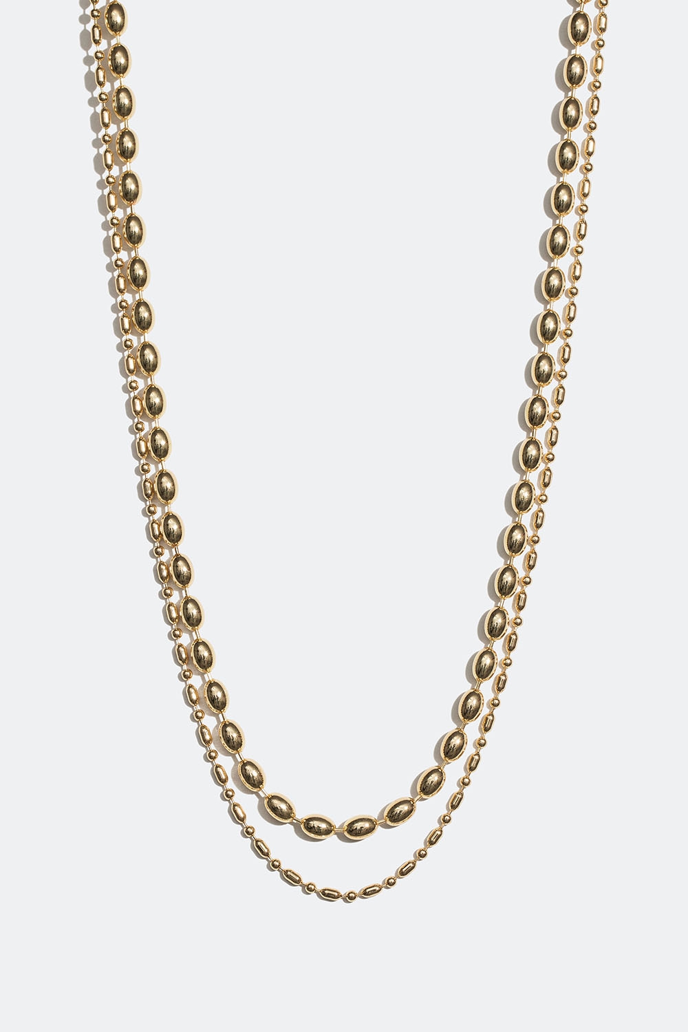 Guldfärgat dubbelhalsband med ovala pärlor i metall i gruppen Smycken / Halsband / Halsband med hänge hos Glitter (254001312002)