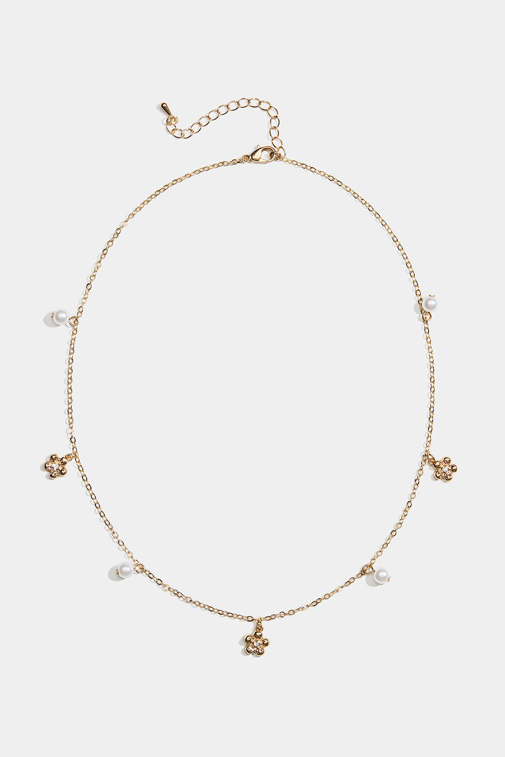 Guldfärgat halsband med blommor och vita pärlor i gruppen Store week / 2610 hos Glitter (254002572002)