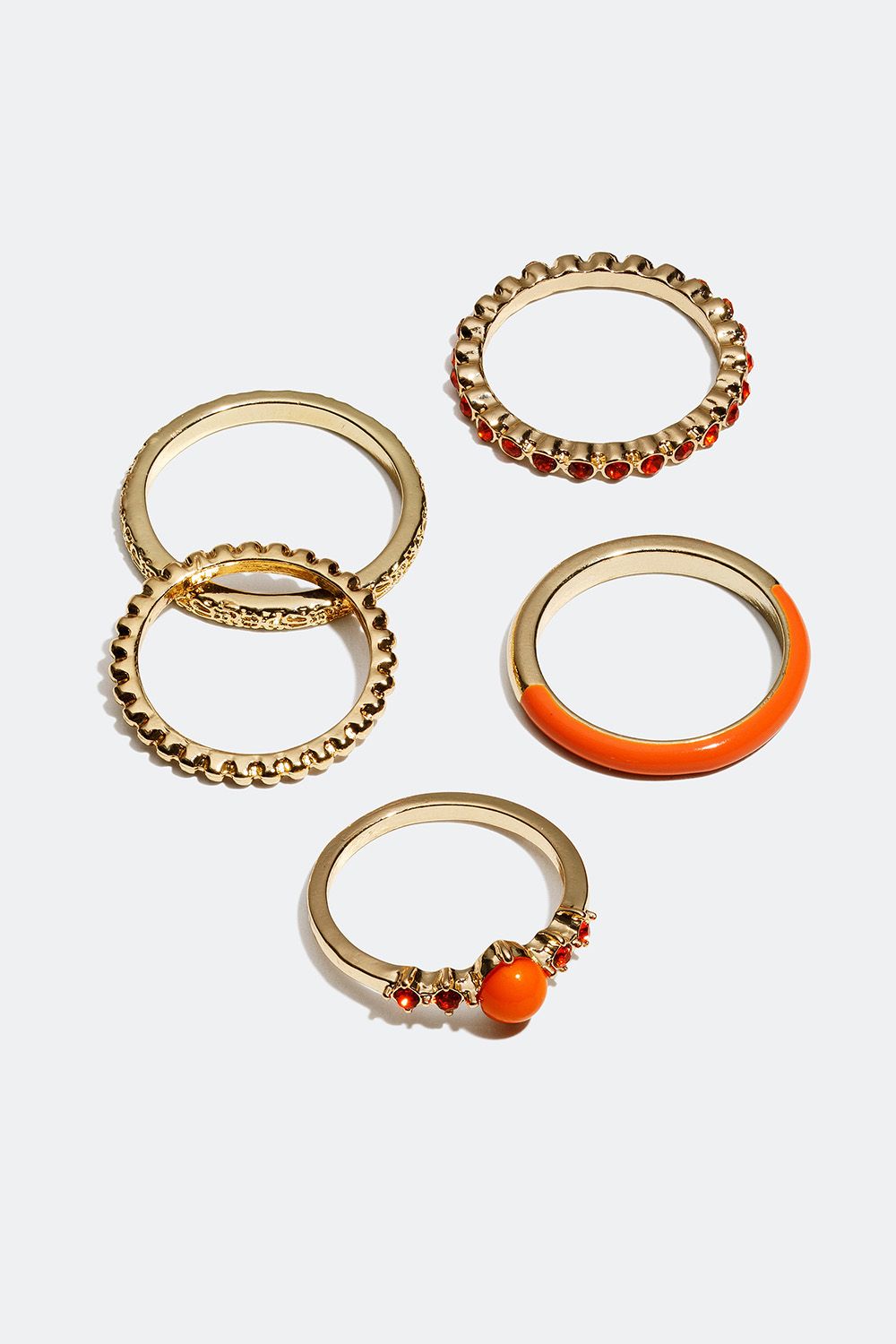 Guldfärgade ringar med detaljer i orange, 5-pack i gruppen Smycken / Ringar / Flerpack hos Glitter (256000624)