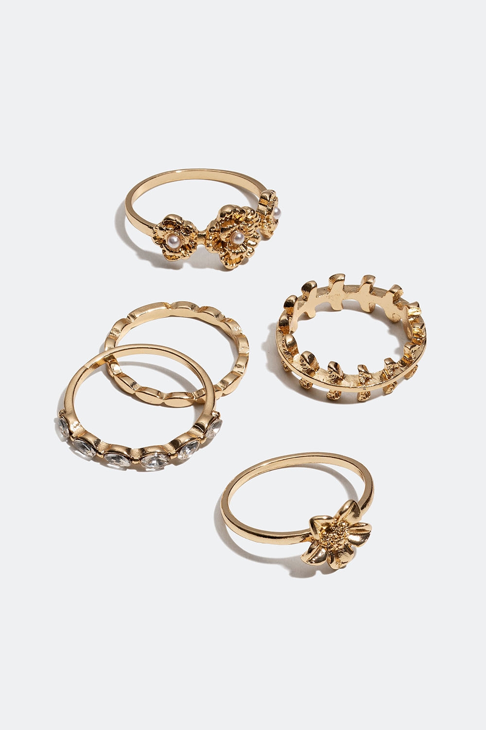 Guldfärgade ringar med blommor och glasstenar, 5-pack i gruppen Smycken / Ringar / Flerpack hos Glitter (256000992016)
