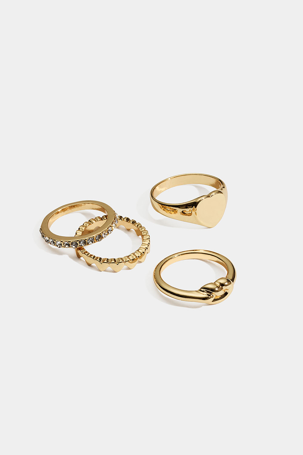 Guldfärgade ringar med hjärta, knut och glasstenar, 4-pack i gruppen Smycken / Ringar / Flerpack hos Glitter (2560020420)