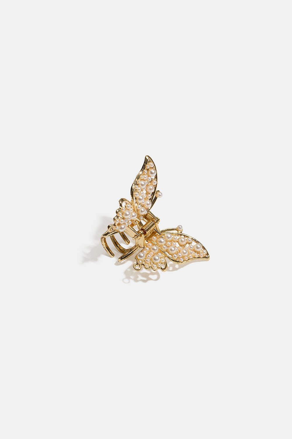 Liten guldfärgad hårklämma med fjärilsdesign och pärlor i gruppen Håraccessoarer / Spännen & klämmor / Hårklämmor hos Glitter (331002362000)