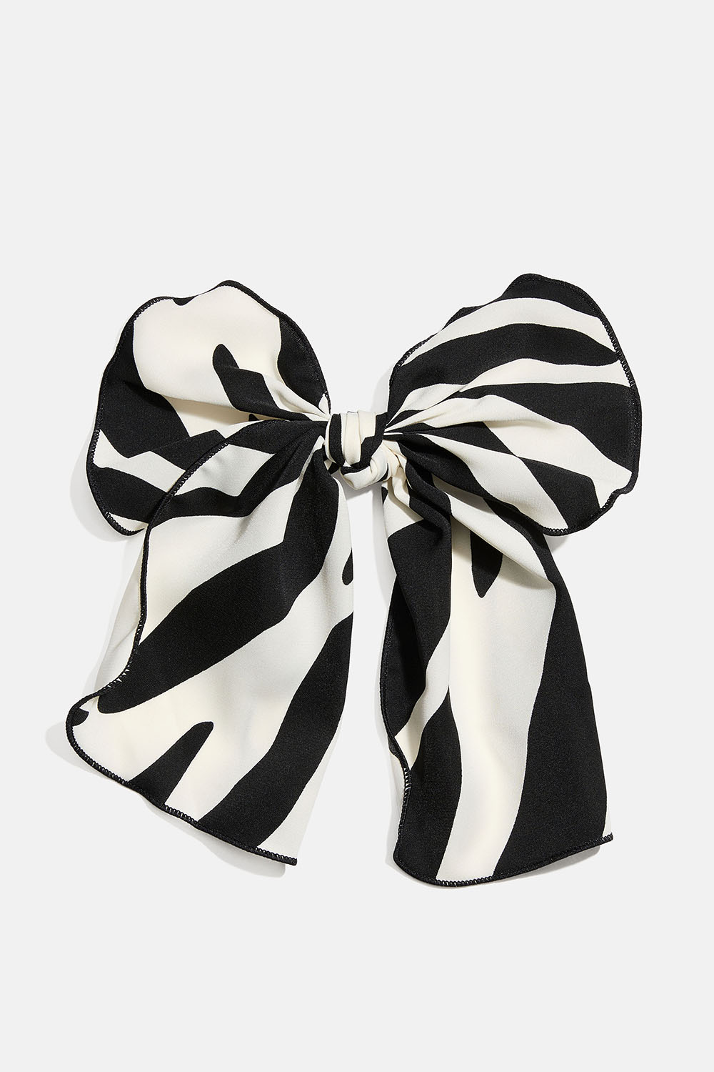 Hårspänne med rosett i zebramönstrat tyg i gruppen Håraccessoarer / Spännen & klämmor / Hårdekorationer hos Glitter (335002080800)