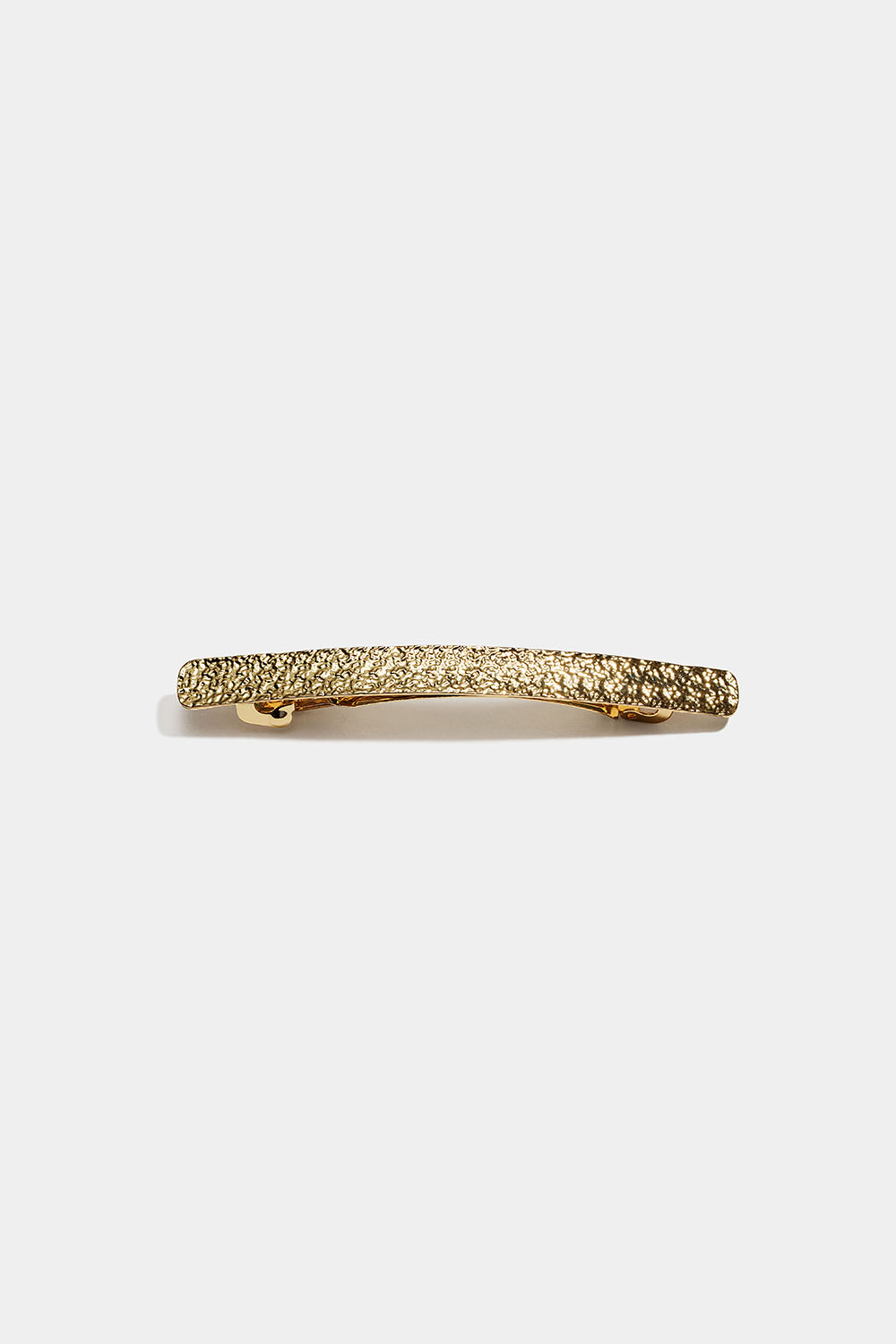 Smalt guldfärgat hårspänne med hamrad design i gruppen Håraccessoarer / Spännen & klämmor / Hårspännen hos Glitter (335002262000)