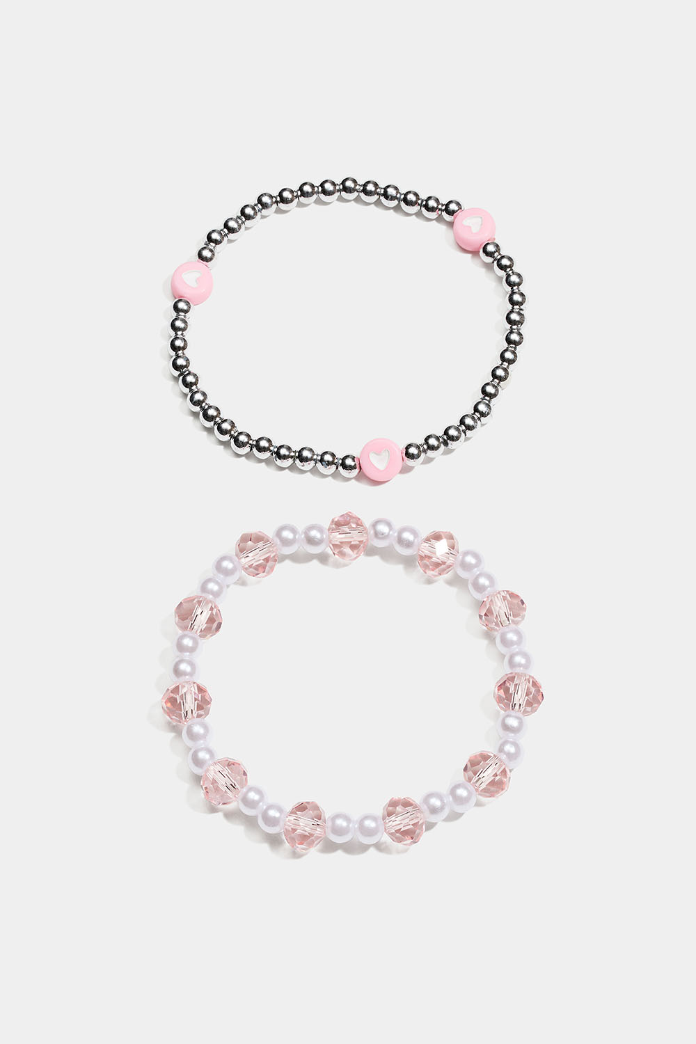 Elastiska armband med pärlor i rosa, vitt och silverfärg i gruppen Barn / Barnsmycken / Barnarmband hos Glitter (402000469900)