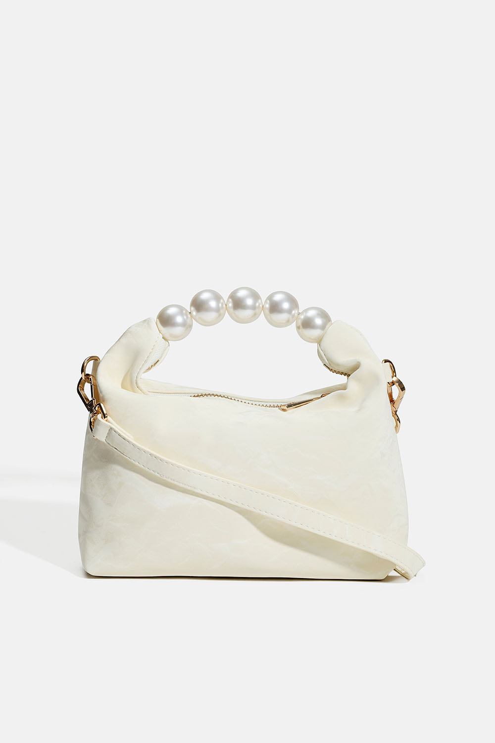 Liten vit väska med pärlhandtag