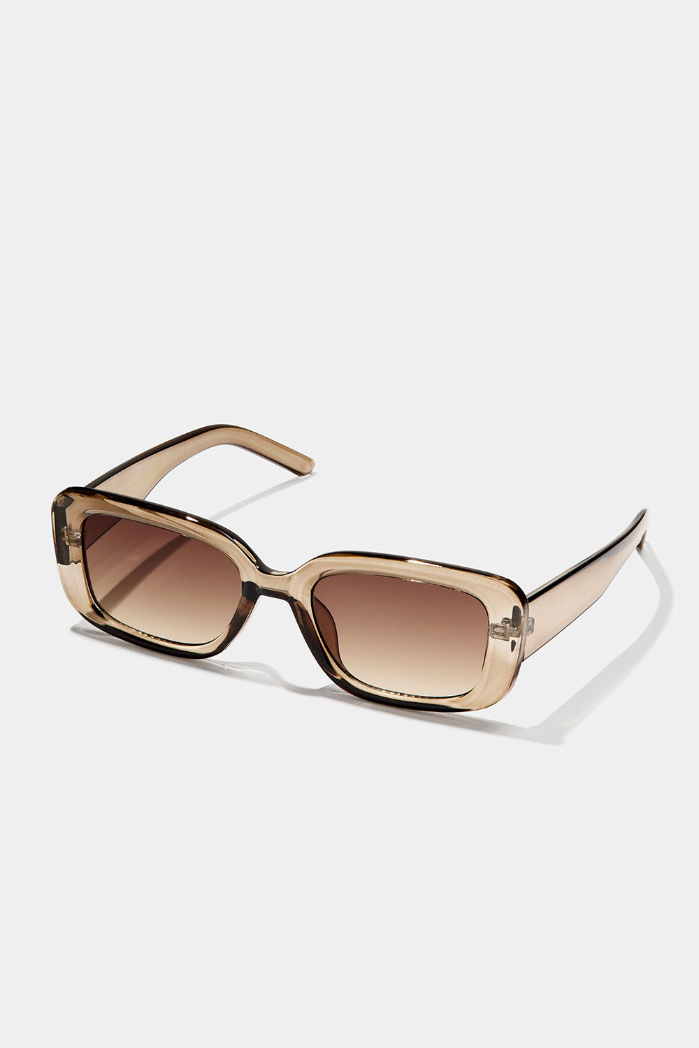 Kantiga solglasögon med transparanta ljusbruna bågar