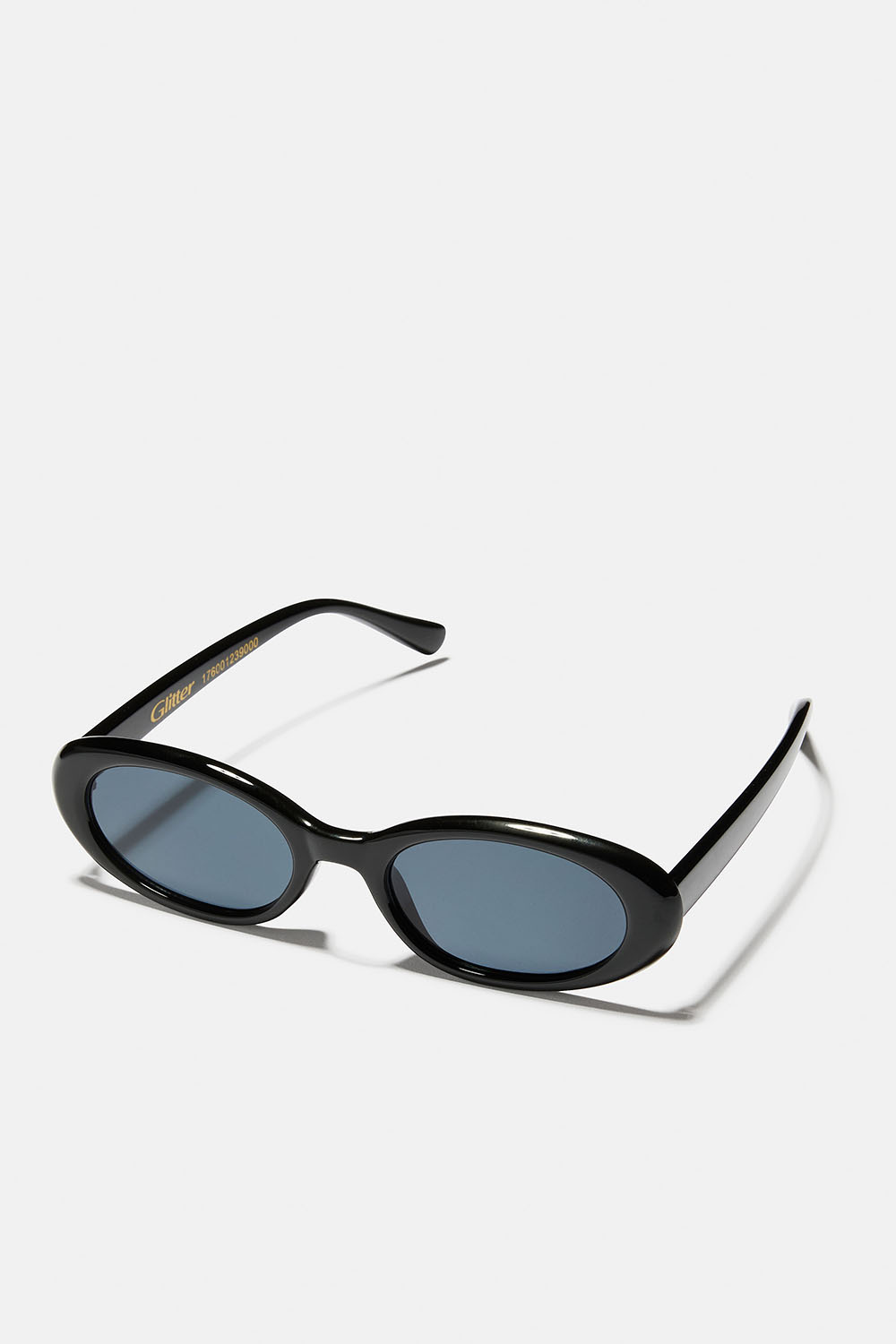 Ovala solglasögon med svarta bågar