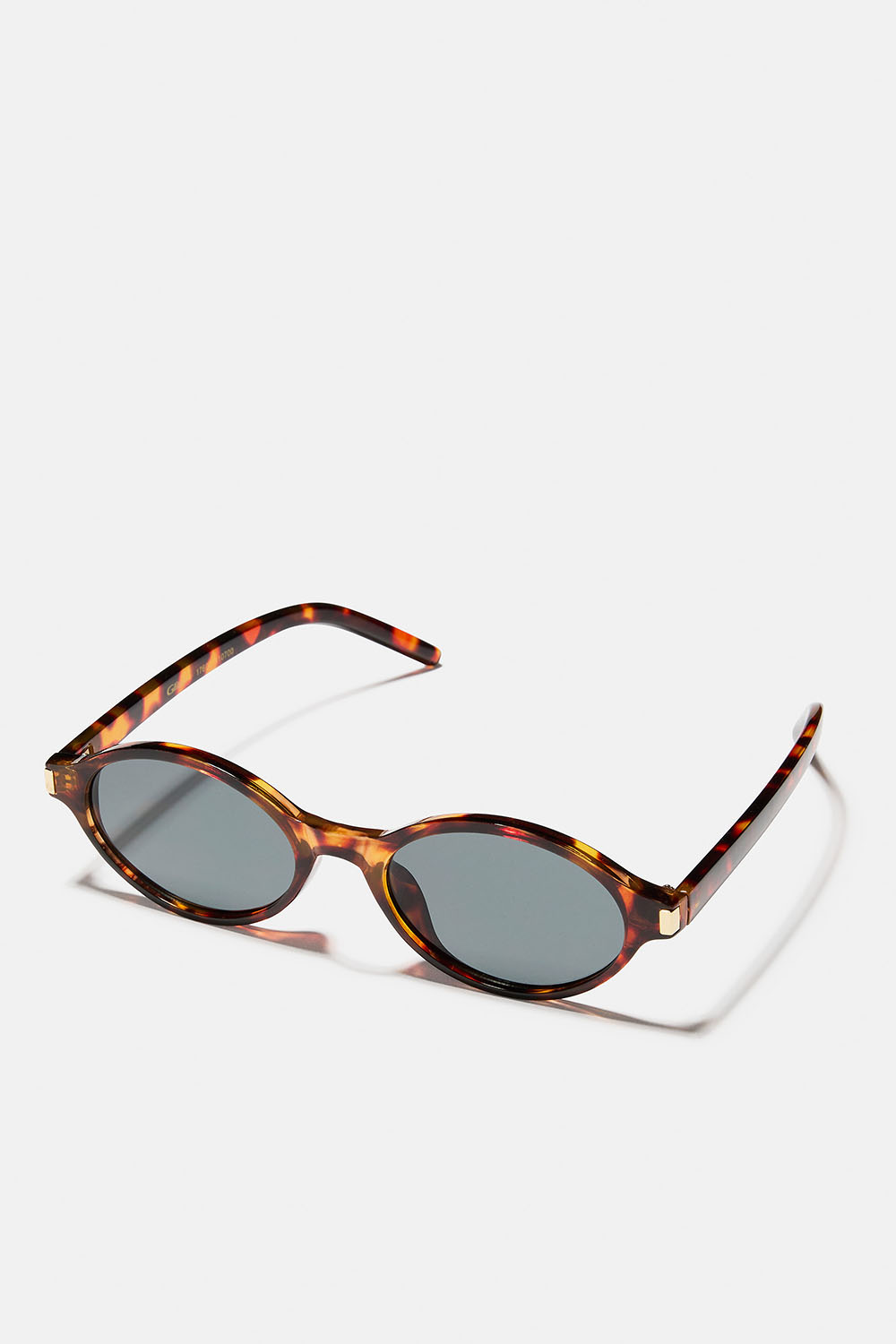 Bruna ovala solglasögon med guldfärgad detalj