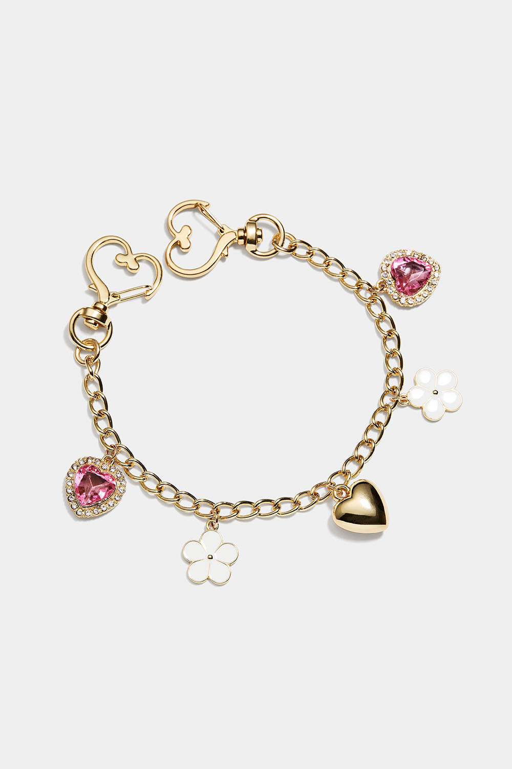 Väskdekoration med blommor och hjärtan