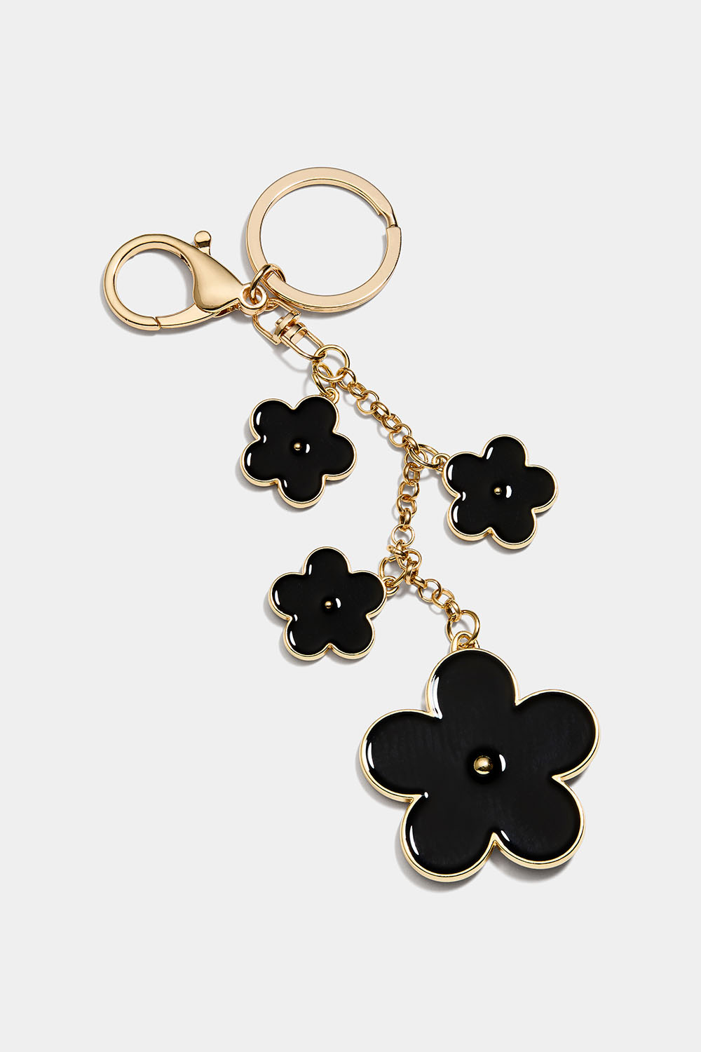 Väskdekoration med svarta blommor