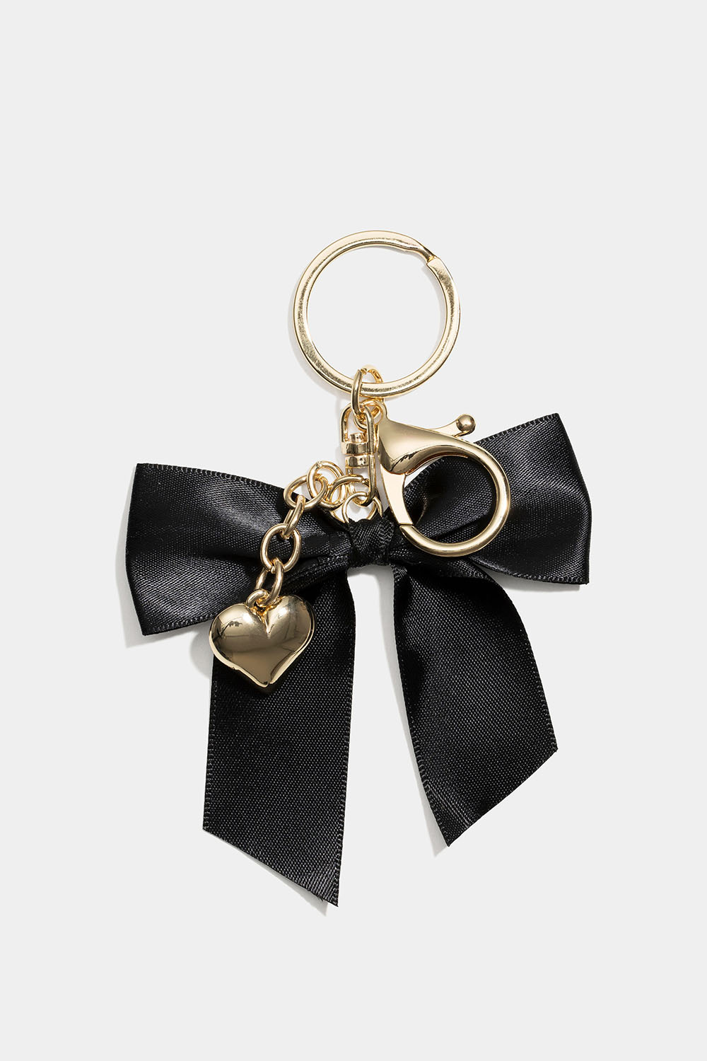 Väskdekoration med rosett och hjärta