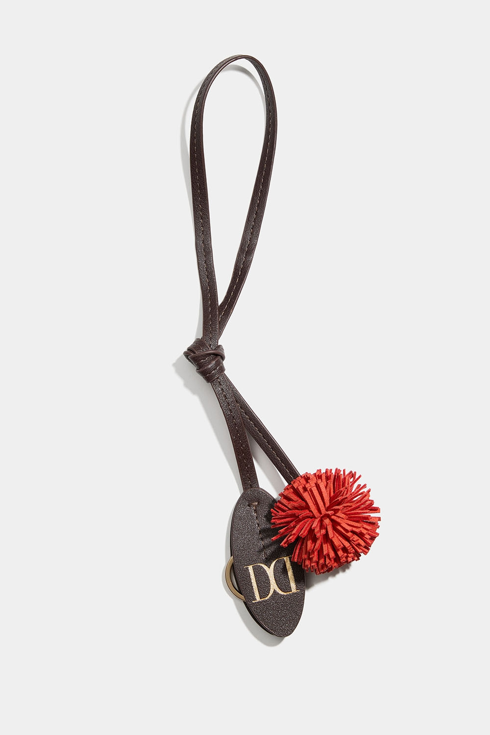 Väskdekoration med pompom och nyckelring