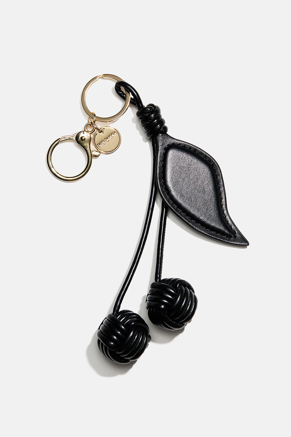 Väskdekoration med körsbär i svart läderimitation 