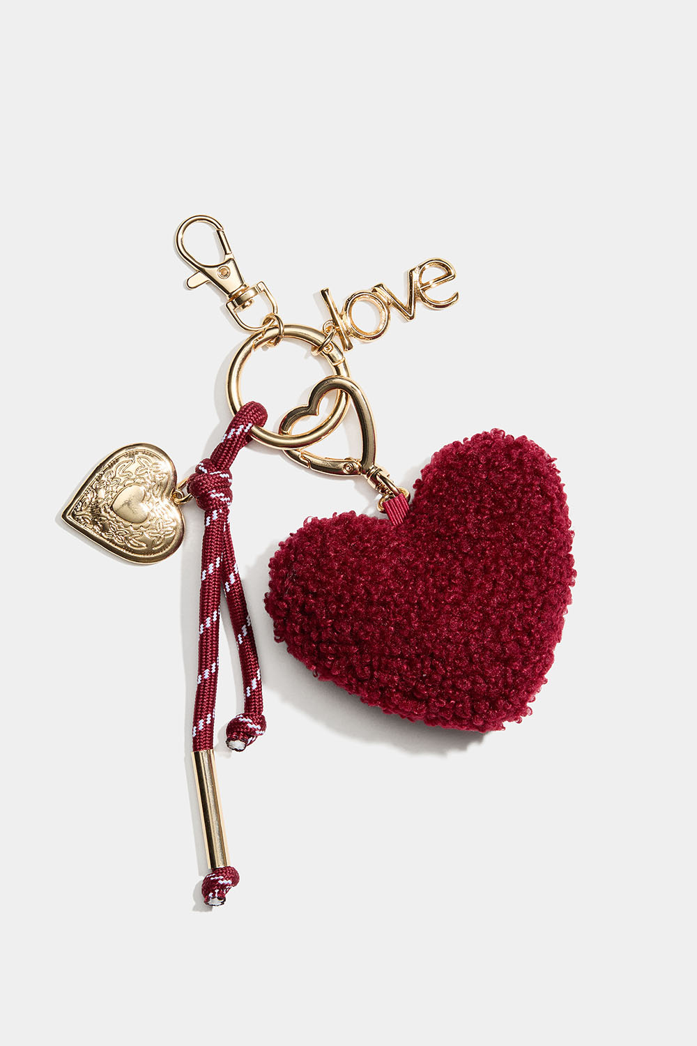 Väskdekoration med hjärta och berlocker