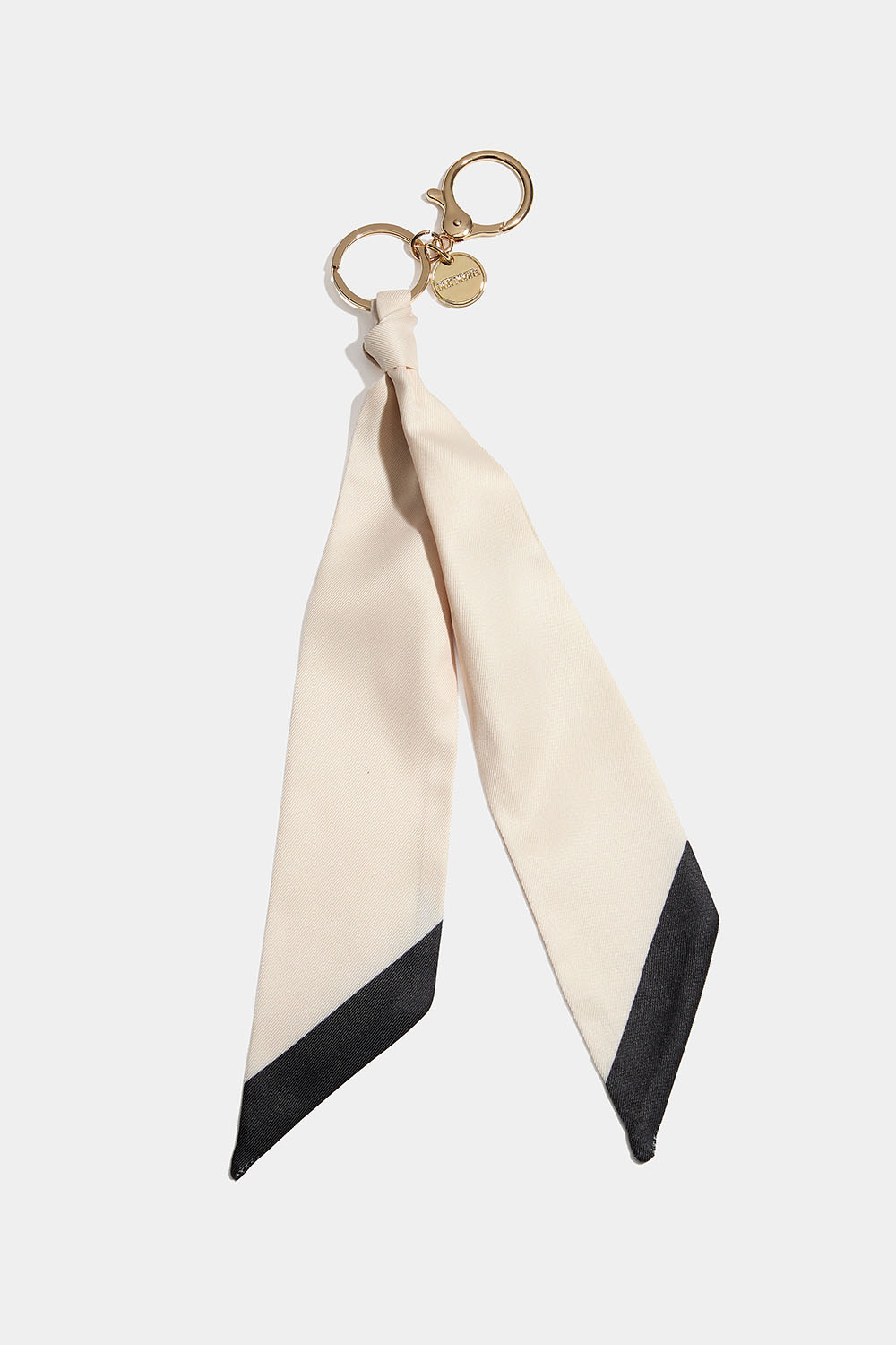 Väskdekoration med beige scarf