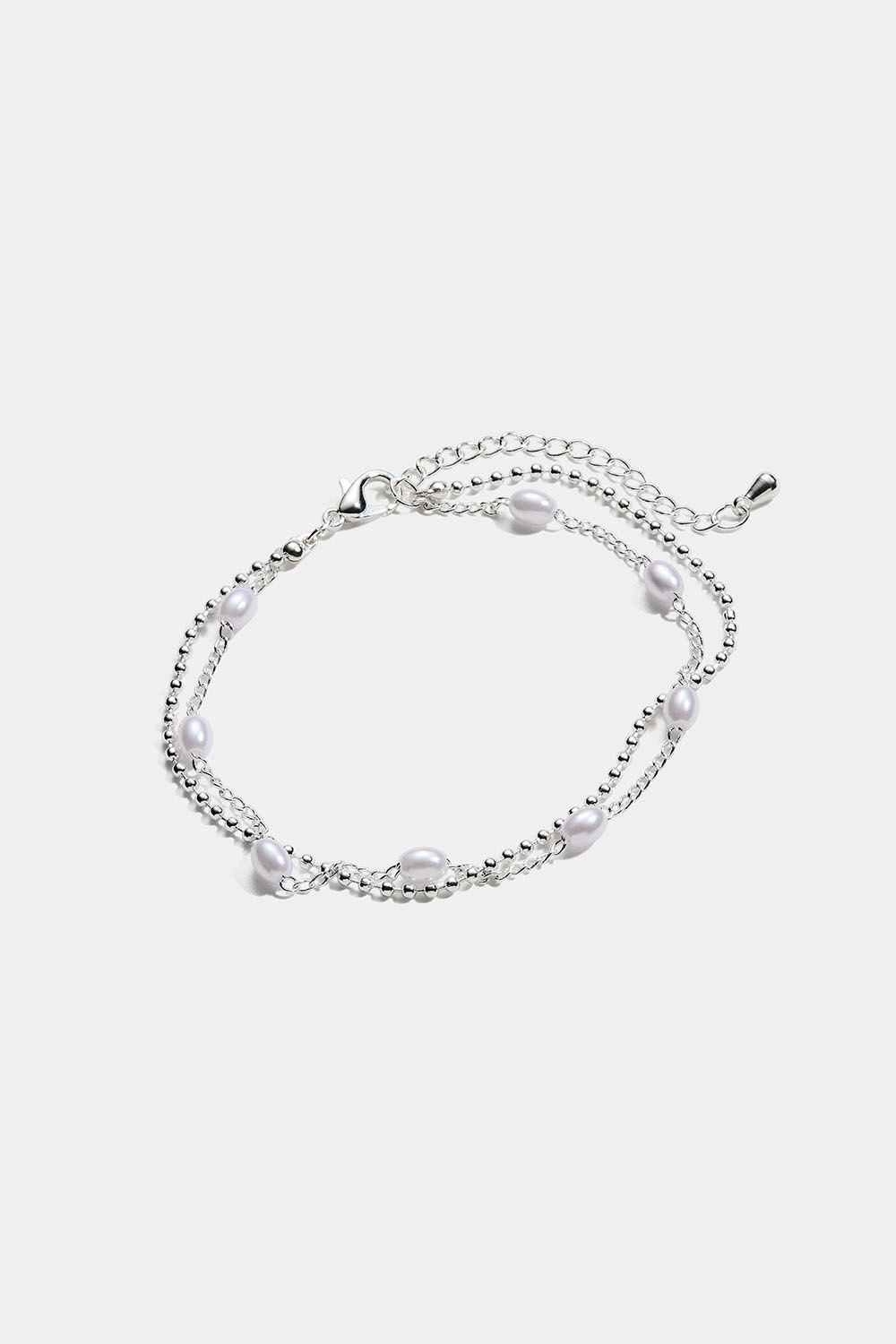 Dubbelarmband med ovala pärlor