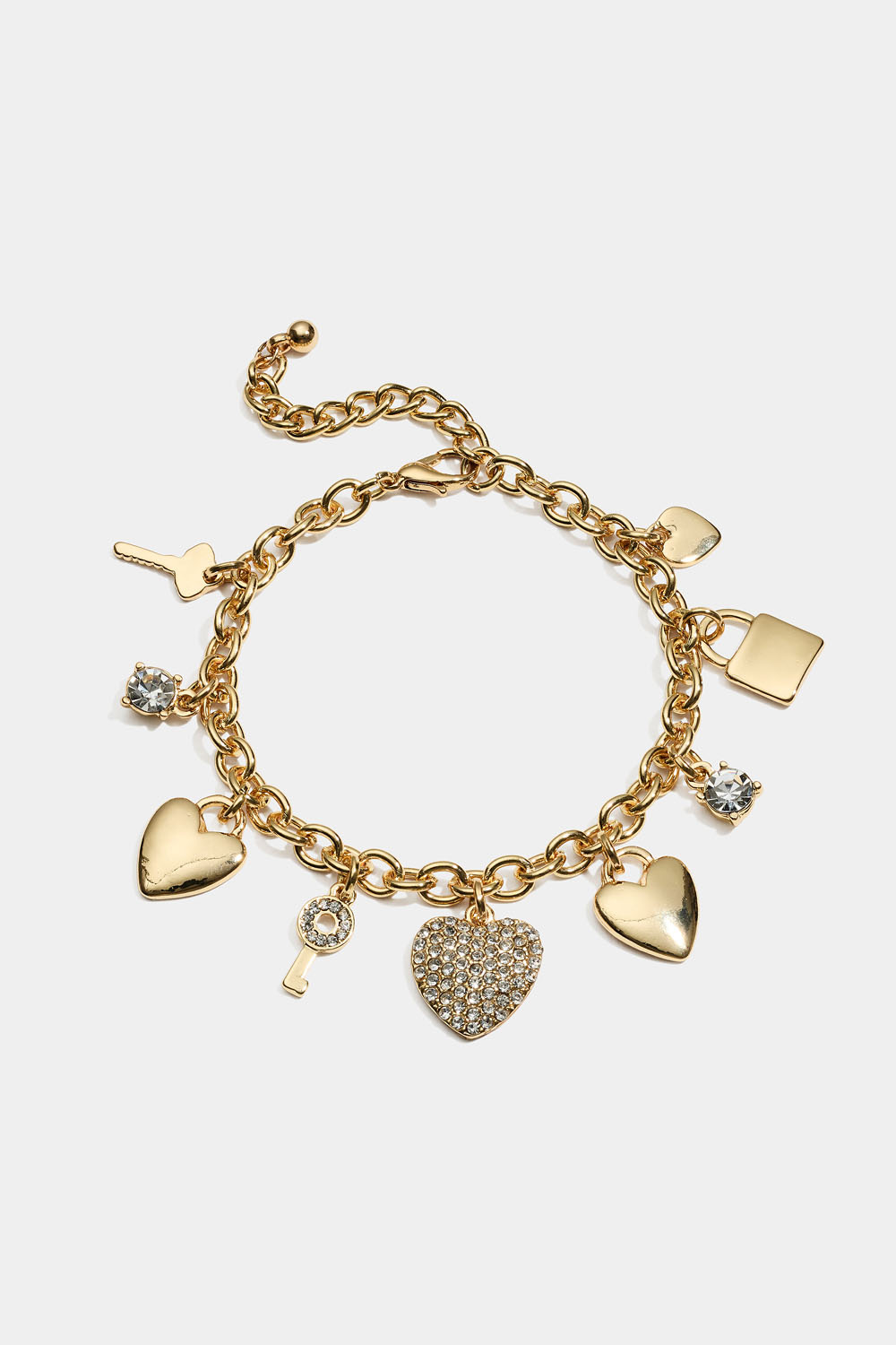 Guldfärgat armband med nycklar och hjärtan