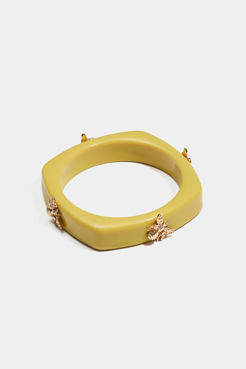 Bangle med guldfärgade bin