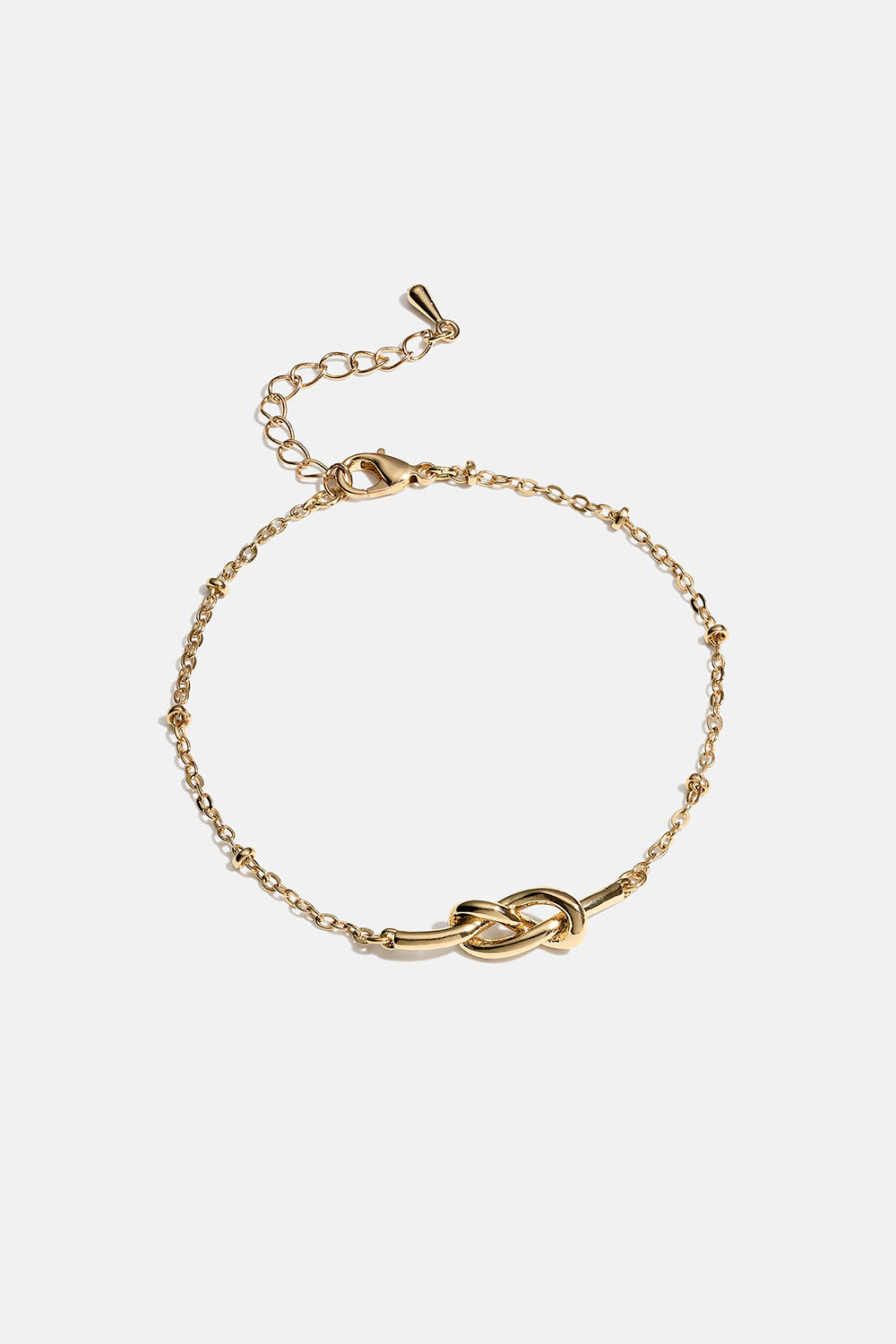 Guldfärgat armband med knut