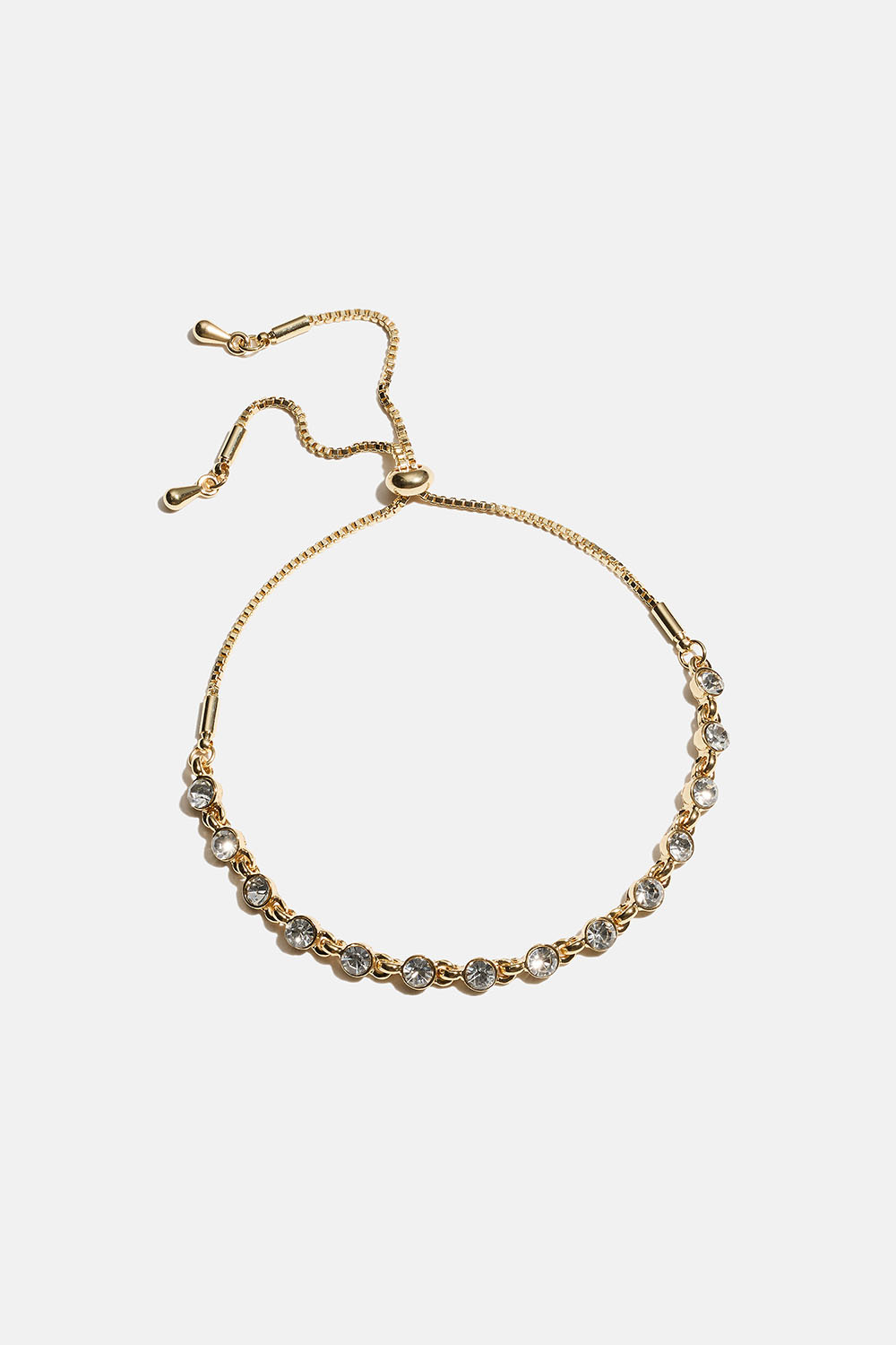 Guldfärgat armband med små runda glasstenar