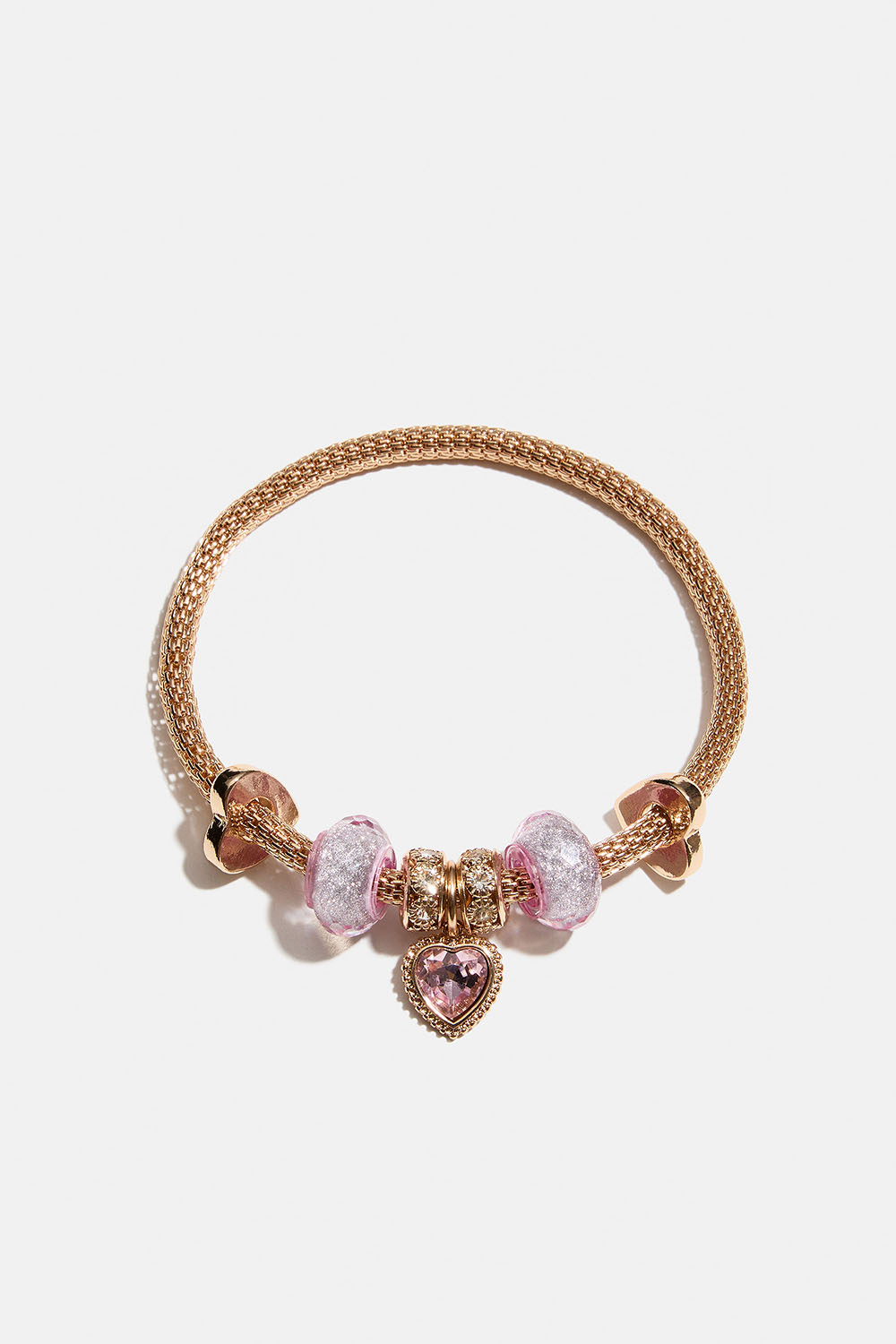 Elastisk guldfärgat armband med berlocker i rosa detaljer