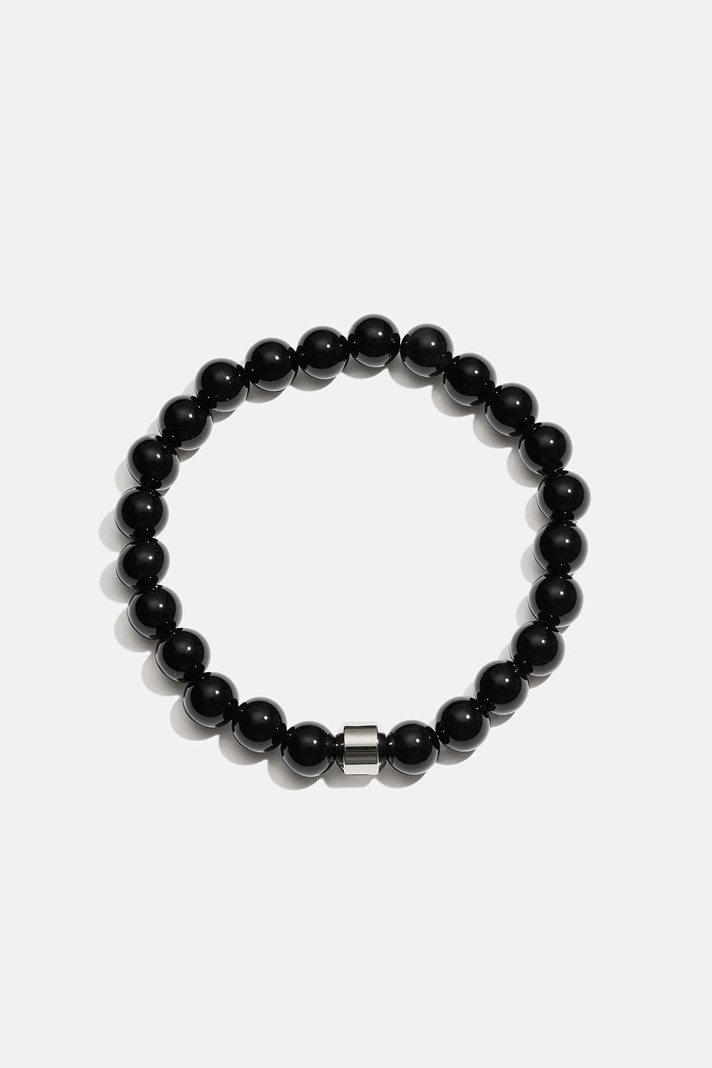 Armband med svarta onyx naturstenar och stålpärla