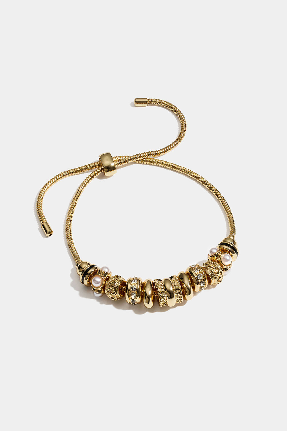 Guldfärgat armband med runda berlocker med glasstenar och pärlor