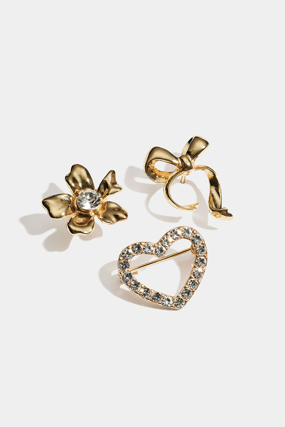 Guldfärgade broscher med rosett, blomma och hjärta, 3-pack