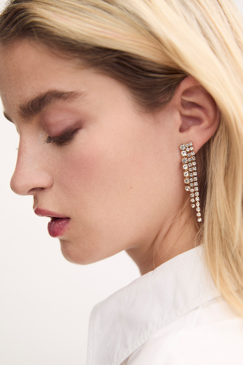 Guldfärgade strassörhängen med tre länkar