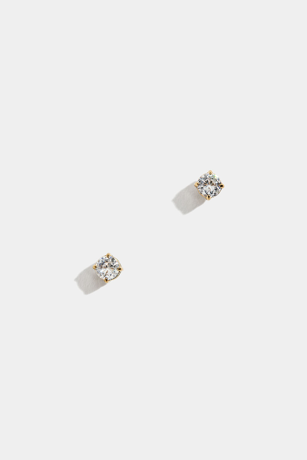Små studs i stål med 18k guld och Cubic Zirconia