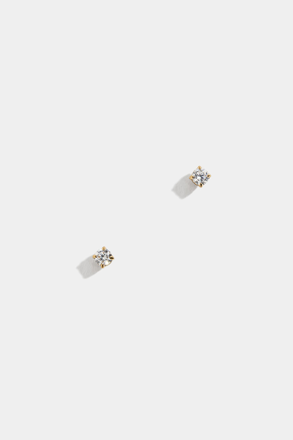 Mini studs i stål med 18k guld och Cubic Zirconia