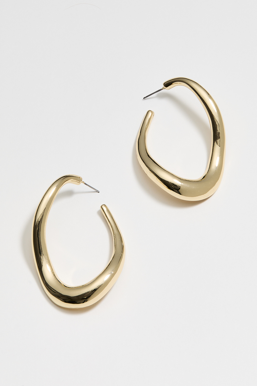 Stora guldfärgade hoops med vågig form