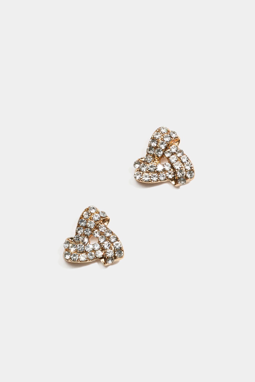 Guldfärgade studs med trekantiga knutar och strass