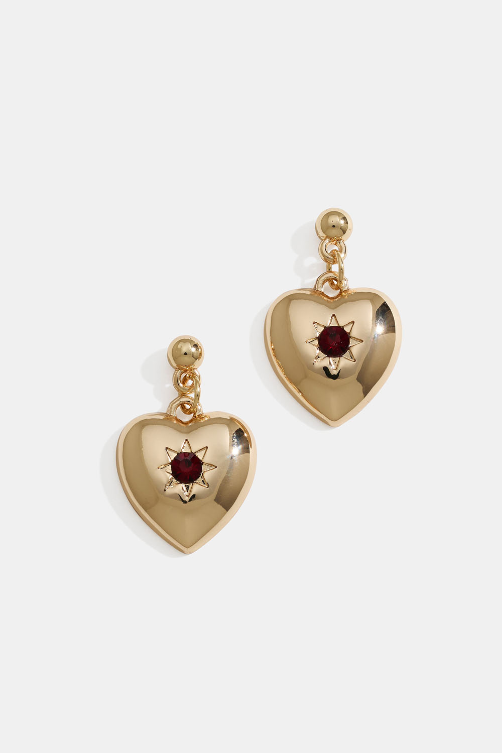 Guldfärgade hjärtörhängen med stjärnor