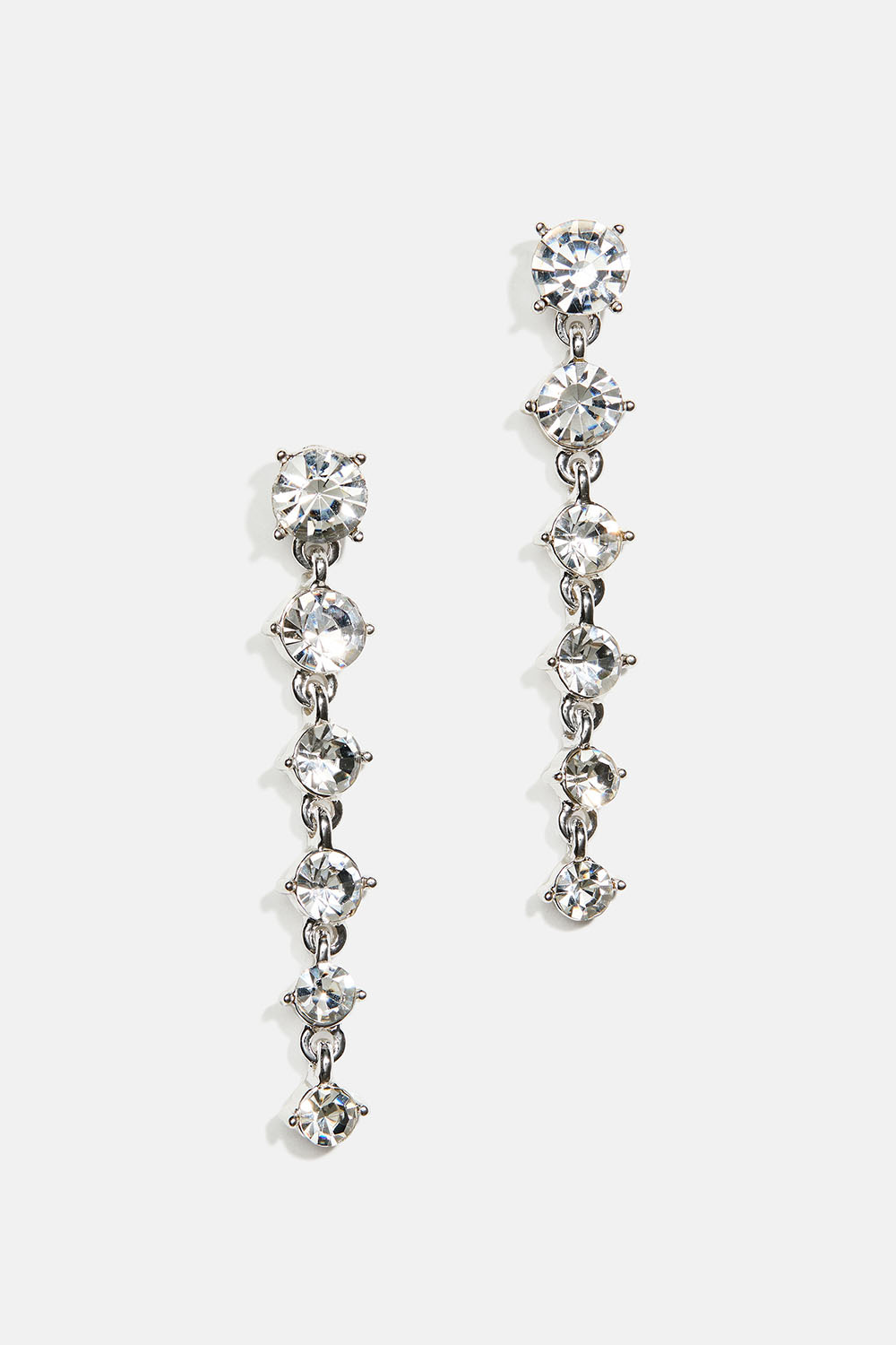 Örhängen med vita runda glasstenar