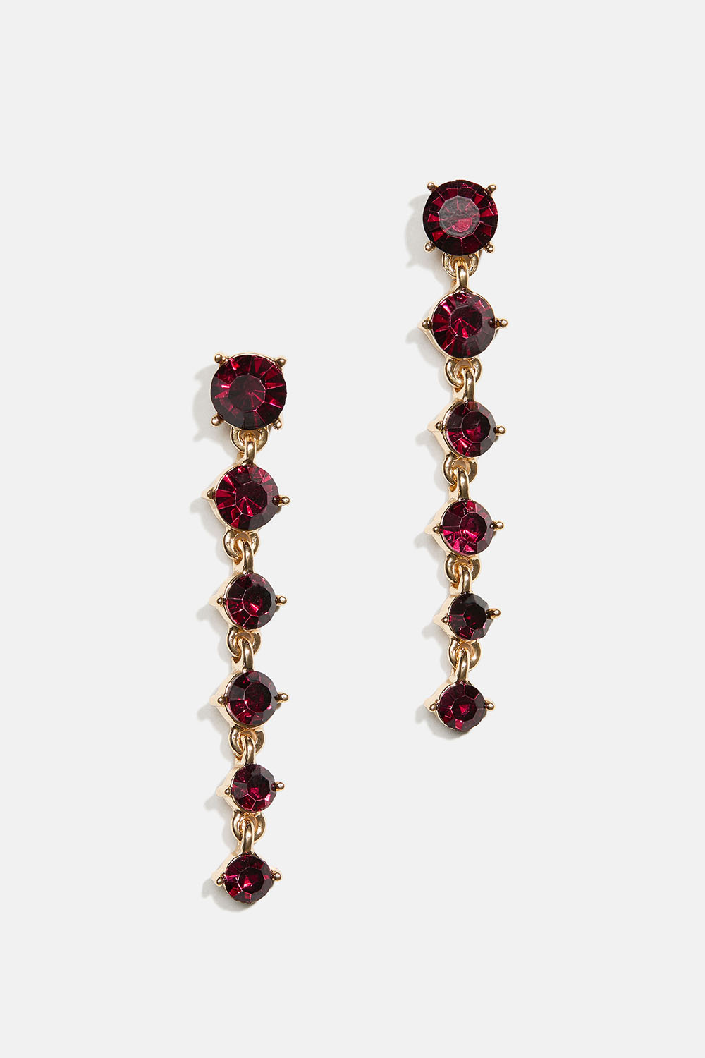 Örhängen med vinröda runda glasstenar