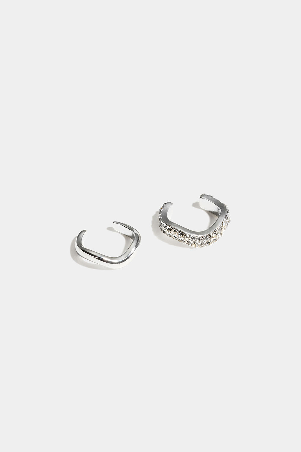 Vågiga ear cuffs med glasstenar, 2-pack