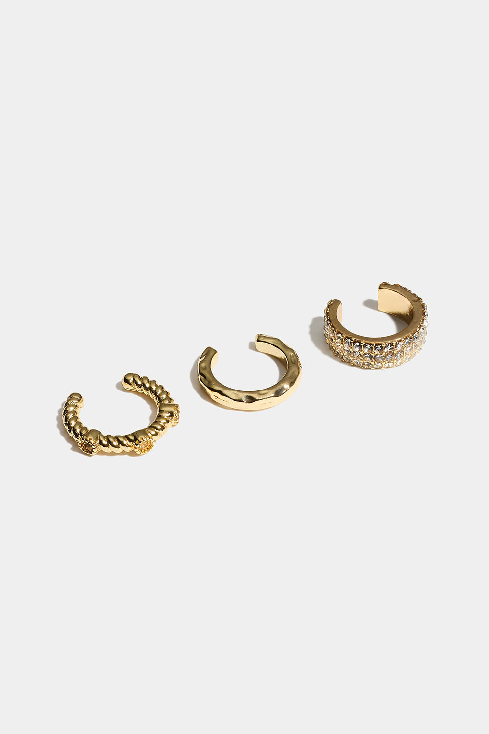 Guldfärgade ear cuffs med struktur och glasstenar, 3-pack