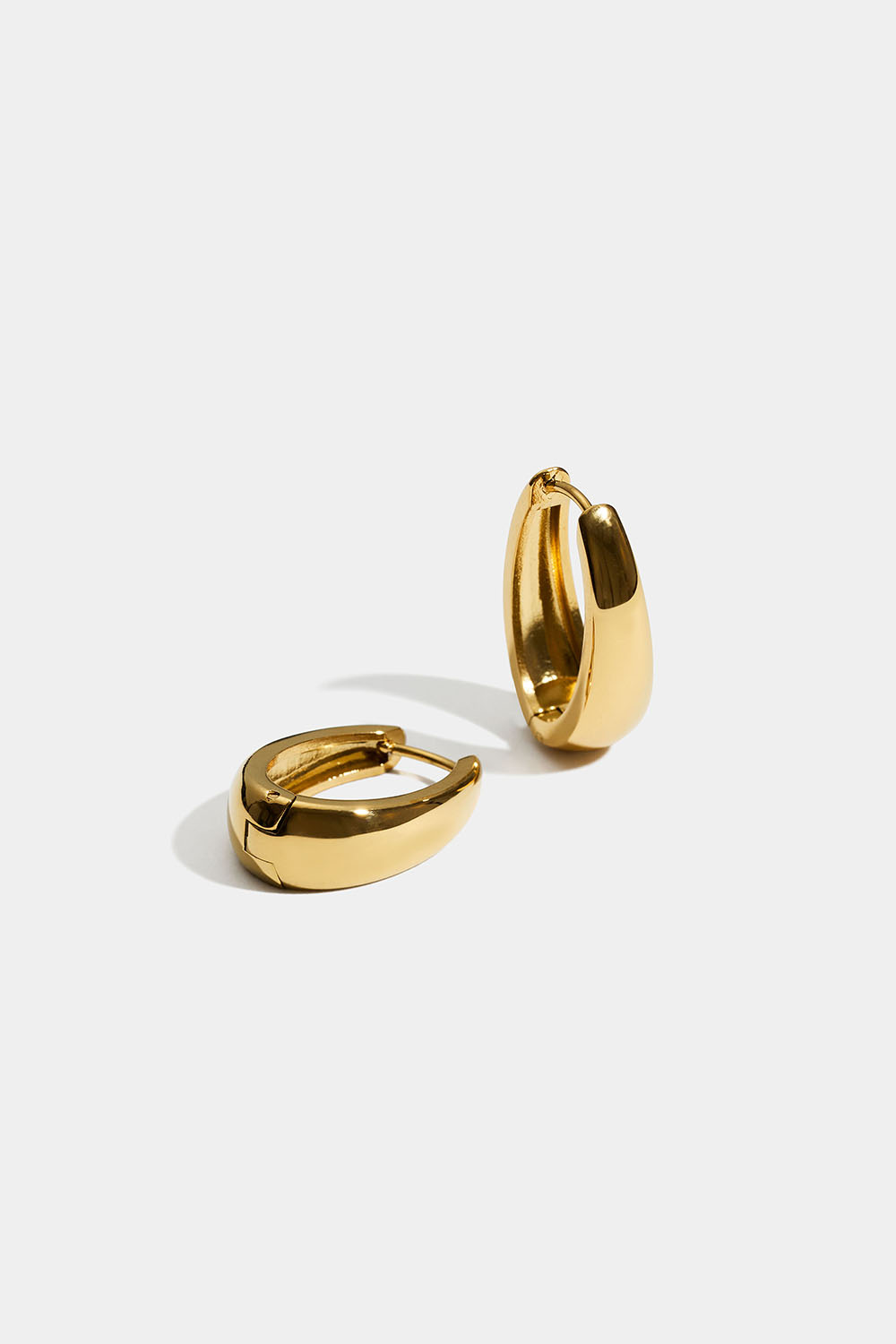 Ovala hoops i stål med 18k guld