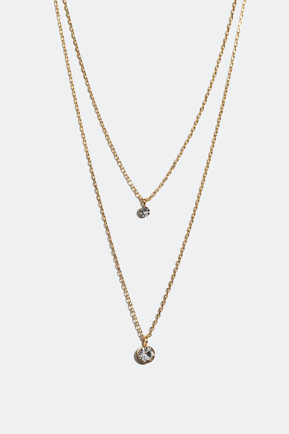 Guldfärgat dubbelhalsband med två små glasstenar